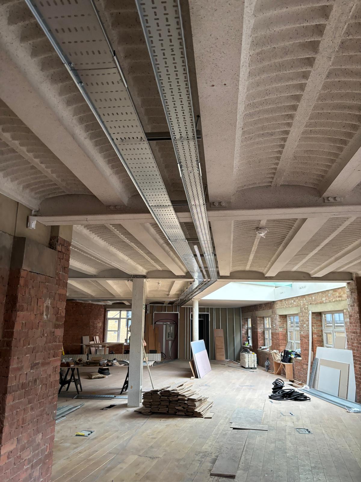 Commercial cable containment installed across a renovation ceiling