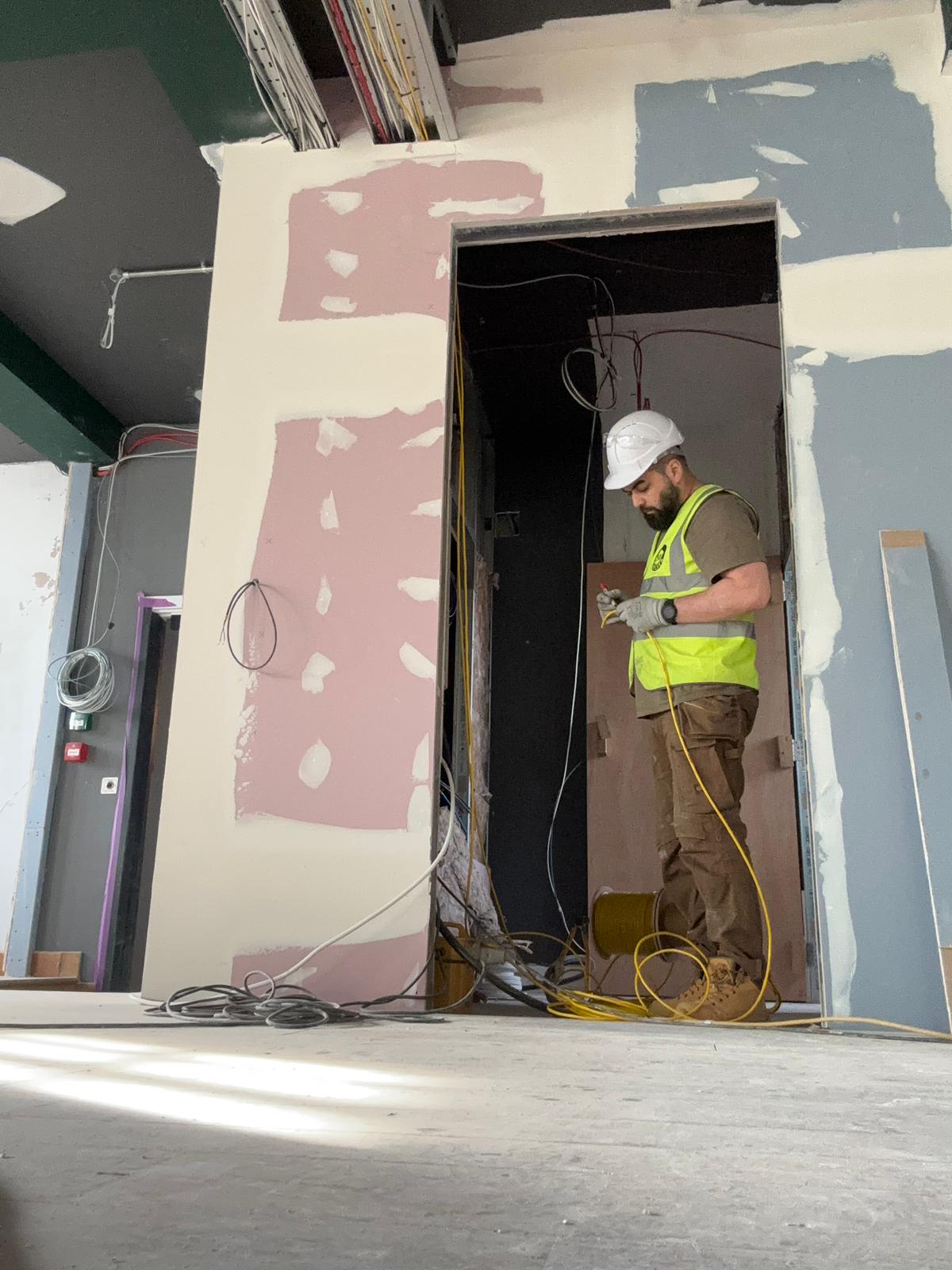 Nour Electrical electrician carrying out wiring work on a London renovation project