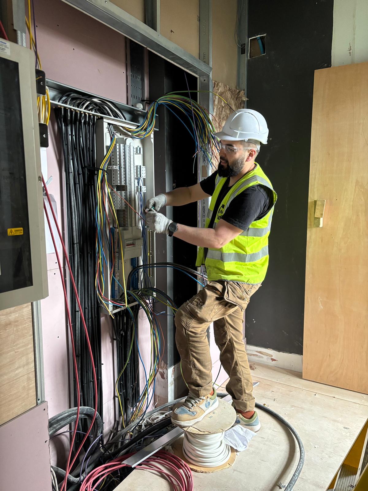 Nour Electrical electrician wiring a commercial electrical panel in London