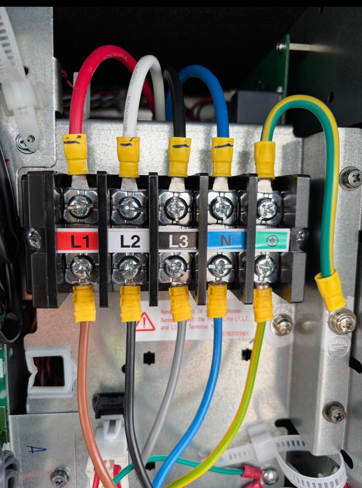 Three phase electrical terminals labelled L1 L2 L3 neutral and earth